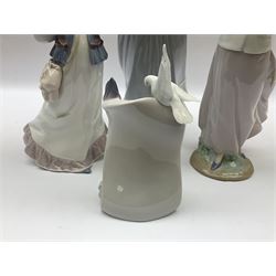 Three Lladro figures, comprising, Dreams of Summer Past no 6401, Spring Breeze no 4936 and Breezy Afternoon 5682 together with Lladro plaque Art Brings us Together no 7677, all in original boxes, largest example H35cm