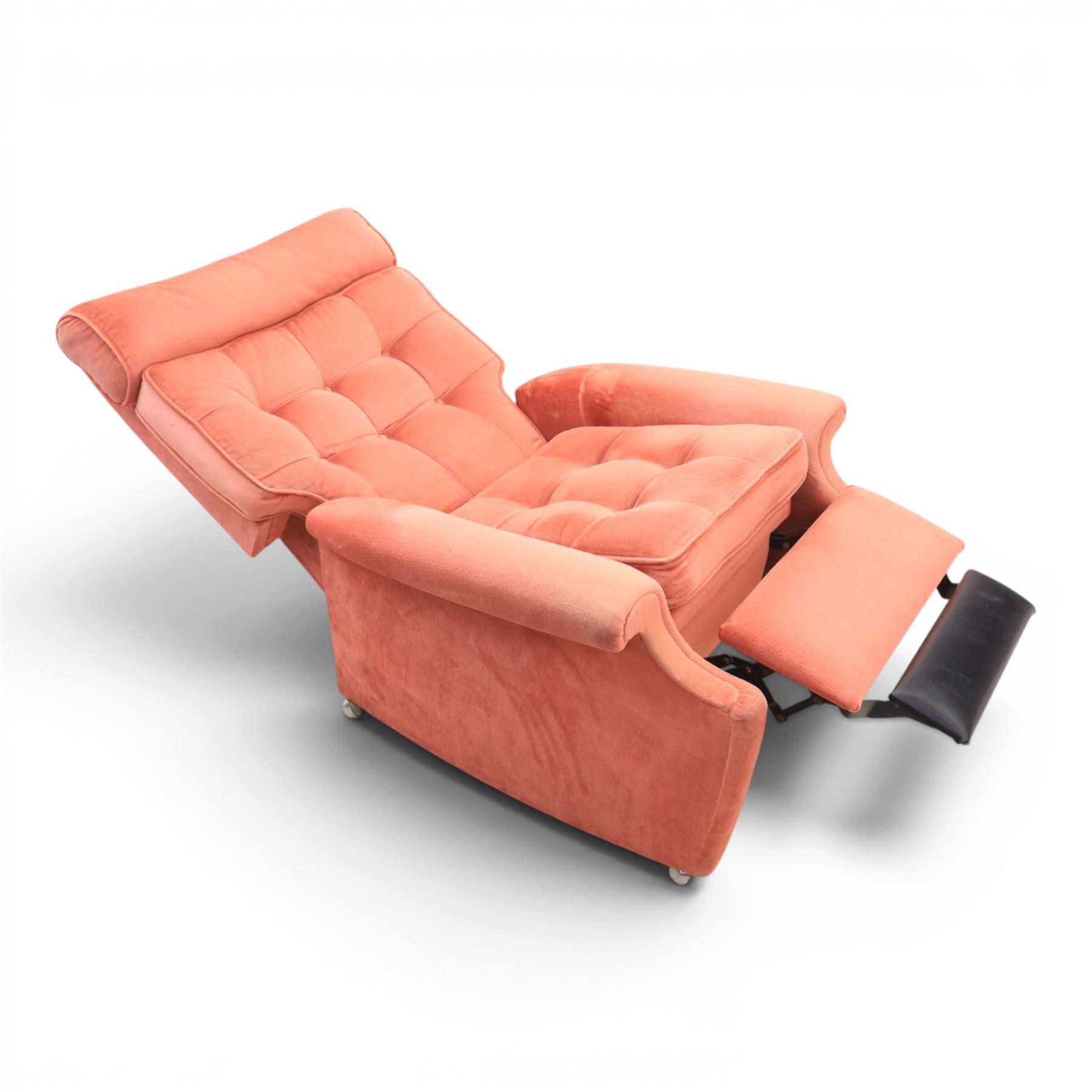 Parker Knoll - mid-century armchair suite, 'Model N30' recliner armchair with headrest and deep buttoned seat and back raised on castors, a wide armchair with deep button back and seat raised on castors, a wingback chair with flared scrolled arms, raised on cabriole supports