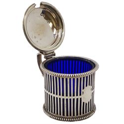 Victorian mustard pot and cover, of drum form with flat-topped scroll handle, vacant cartouche, vertical pierced sides and beaded rims, with blue glass liner, hallmarked Chawner & Co, London 1865, approximate silver weight 4.17 ozt (130 grams)