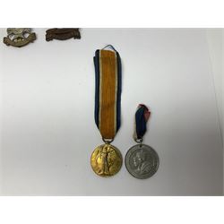 WW1 pair of medals awarded to 151761 Gnr. S. Loten R.A. with ribbons; four WW2 medals with ribbons; and small quantity of cap badges, medallions etc