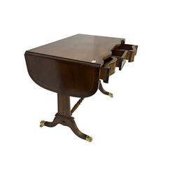 Georgian design mahogany sofa table, shaped drop leaf top over three drawers, on tapered end supports joined by turned stretcher, splayed moulded supports with brass hairy paw cups and castors