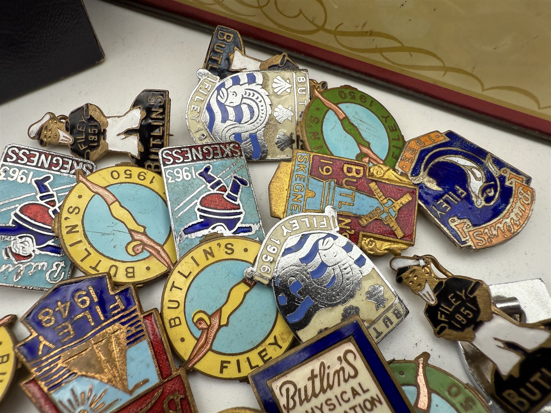 Collection of Butlins enamel pin badges, mostly 1940s/50s Filey examples, together with other enamel pins and costume jewellery