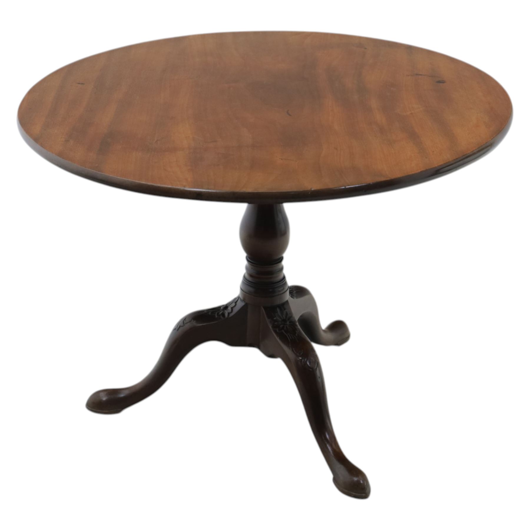 19th century quality mahogany tripod table, the circular tilt top supported on a turned baluster column with downswept cabriole legs carved with flower heads and terminating in pad feet