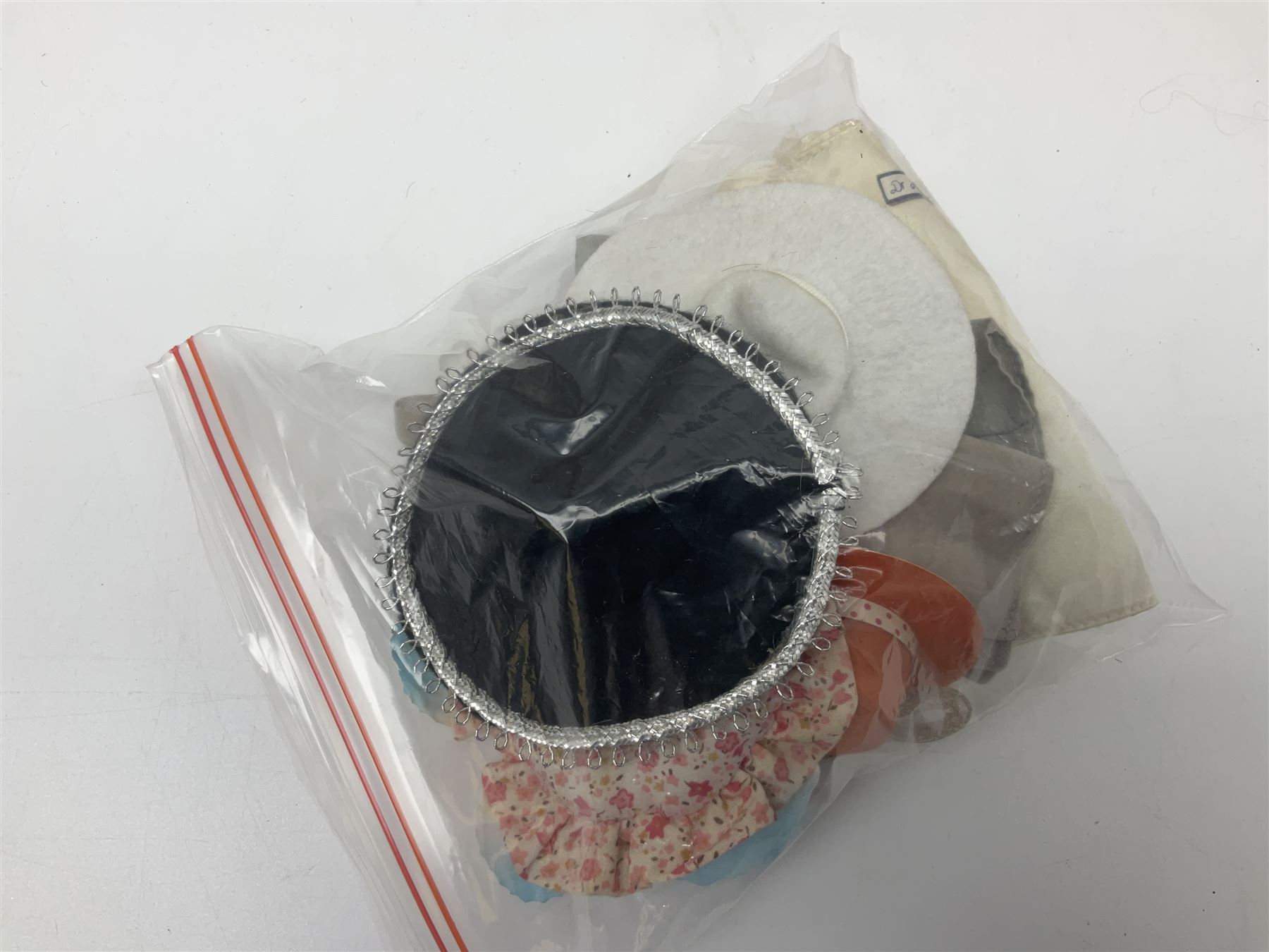 Eleven 1980s fashion dolls, predominantly Barbie/Ken, all dressed; together with some additional clothing.