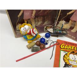 Two boxed Bradgate Penny Puppywalker dolls; Garfield soft toy and Panini sticker album; boxed Stylophone with instructional 45rpm record; and other toys