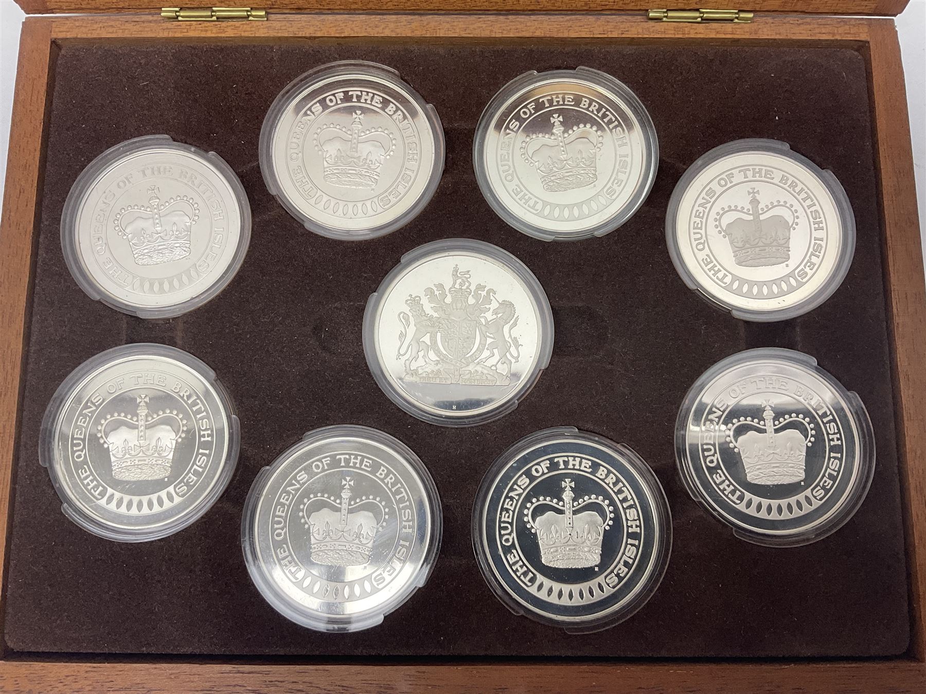 The Birmingham Mint 'The Queens Of The British Isles' sterling silver hallmarked nine medal set, housed in a fitted case, overall combined weight of the medals approximately 400 grams