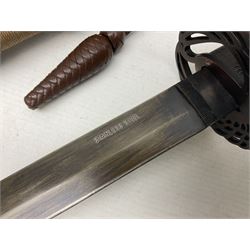 Reproduction Scottish officers basket hilt broad sword, the brass basket pierced with heart-shaped motifs lined with red lining, together with a reproduction Japanese Katana sword, longest L110cm