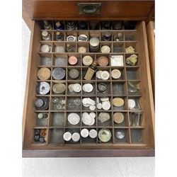 Edwardian mahogany artist's cabinet once belonging to the British artist Eli Marsden Wilson (1877-1965), raised panelled back mounted by carved brackets, sloped and hinged glazed lid enclosing paint holders and compartments, up-and-over panelled door revealing three slides, fitted with two banks of five graduating drawers with recessed brass handles, on skirted base.

Together with a quantity of artists' equipment and tools including paints, paintbrushes, charcoal, chalks, etc. and various prints relating to the life of the artist, including Quaker anti-war posters, Victorian Stevengraphs, and various chromolithographs 

Provenance: Removed from the studio of Eli Marsden Wilson. The cabinet comes to us for sale through family descent. The vendor is descendant of Marsden. Many further etchings removed from the cabinet are being sold in the Spring Art Sale, Friday 15th March 2024, Lots 265-271.

Notes: born in Ossett, Eli Marsden Wilson was the only son of Alfred Wilson, a foreman beamer, and Emma Marsden, and had five sisters. After studying at Wakefield College of Art, he moved to the Royal College of Art in London, where he became a pupil of Sir Frank Short. He had his first exhibit at the Royal Academy in 1905, the same year he married fellow artist Hilda Mary Pemberton.

A Quaker, vegetarian, and pacifist, he was a conscientious objector in World War I and as such was imprisoned in 1917 for two years. In September 1922 he was commissioned by Princess Marie Louise to produce miniature etchings for Queen Mary's Dolls' House at Windsor Castle; two such etchings are being sold in the Spring Art Sale, Friday 15th March 2024, Lot 265.