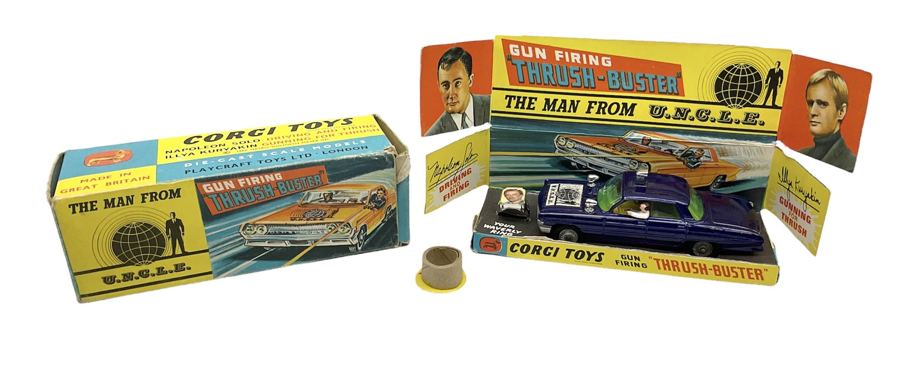 Corgi Toys - 'The Man from UNCLE' Thrushbuster No.497, in blue with cast hubs, plastic lights, complete with plastic figures, inner pictorial stand with circular cardboard packing piece, yellow card protective packing disc and '3-D Waverley Ring'; boxed