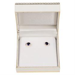 Pair of 9ct gold blue stone stud earrings, boxed