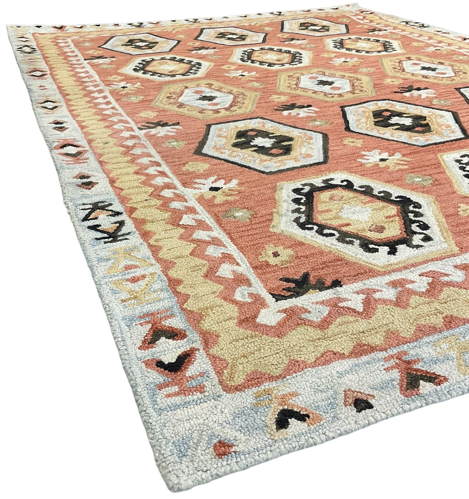 OKA - Turkish design peach ground rug, the field decorated ejder motifs within hooked and geometric design borders 