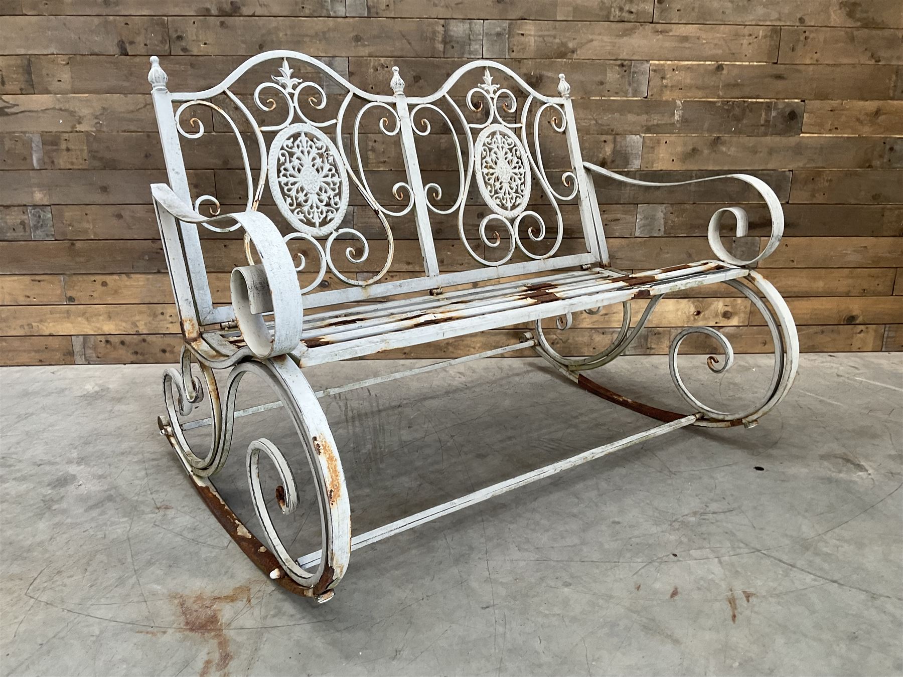 Wrought metal rocking garden bench seat, in antique grey finish