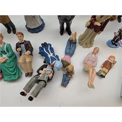 1:12 scale dolls house composite figures, including policeman, postman, maid, sitting and standing people in various styles of dress, etc