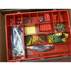 Meccano - one wooden and eight plastic compartmentalised boxes containing a large quantity of well presented accessories, various colours and ages, including small sections, electrical fittings, tyres and wheels, cone and other pulleys, discs, braced girders, fans, crane hooks, loaded sacks, propeller blades, electric motors, power controller, gears and pinions, nuts, bolts and washers etc