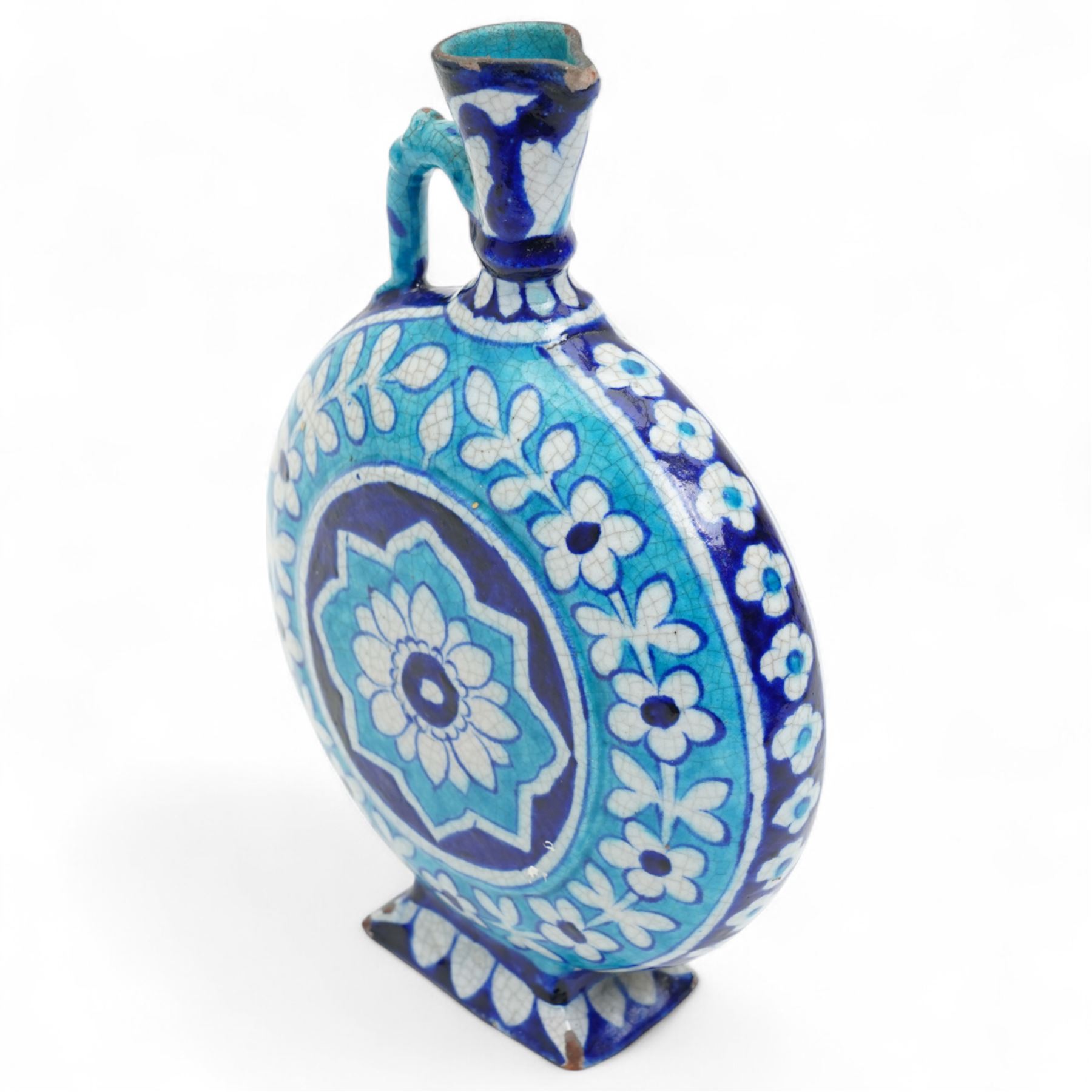Indian 19th century Sind pottery moon flask, painted in colours of turquoise and cobalt blue, each side with lotus motif inside a border of flowers, H22.5cm