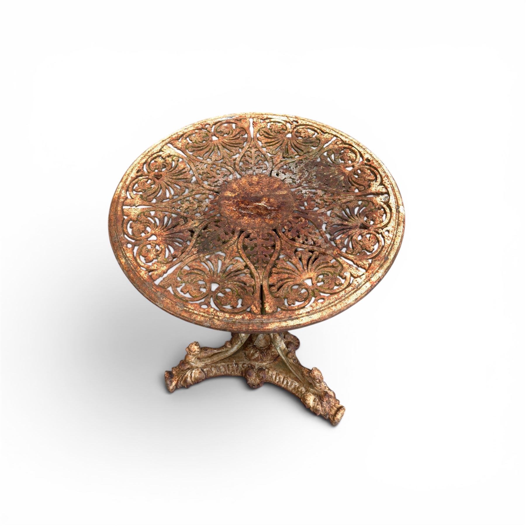 Victorian cast iron garden table, circular pierced top with foliate and scroll decoration, raised on an ornate tripod base with natural weathered paint finish.