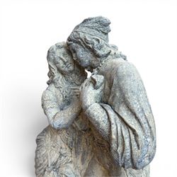 Composite garden statue group of Romeo and Juliet embracing, the couple adorned in Medieval dress standing on a naturalistic base with fallen flowers, raised on a Neoclassical fluted pedestal with Anthemion leaf motifs