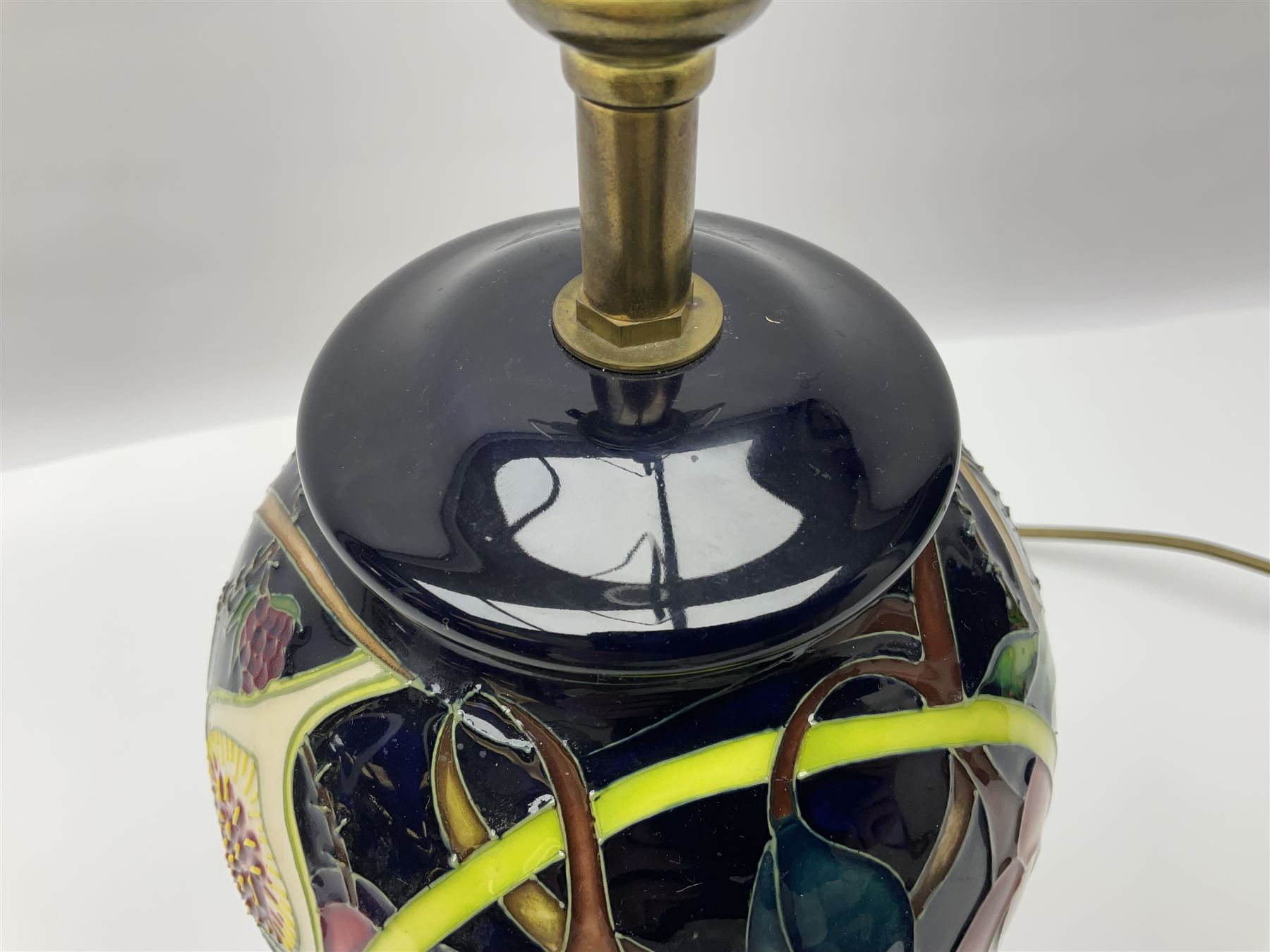 Moorcroft table lamp of baluster form, decorated in the Queens Choice pattern by Emma Bossons, H49cm