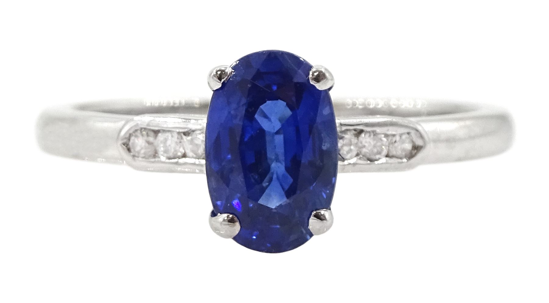 18ct white gold sapphire and diamond ring, single oval cut sapphire of approx 1.20 carat, with diamond set shoulders, hallmarked