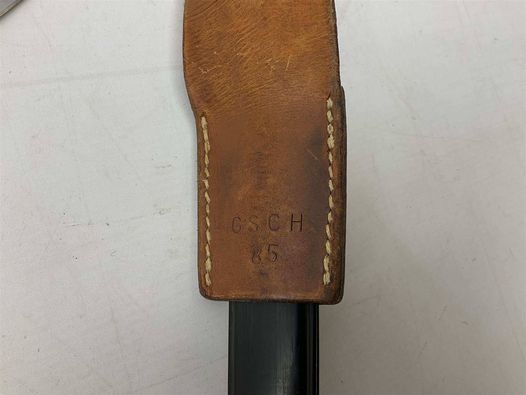 Swiss Model 1957 SIG rifle bayonet by Wenger with 23.5cm steel blade numbered 350857; in plastic scabbard with leather frog stamped GSCH 85 L38cm overall; and Egyptian Hakim rifle bayonet with the same script number to the grip and steel scabbard (2)