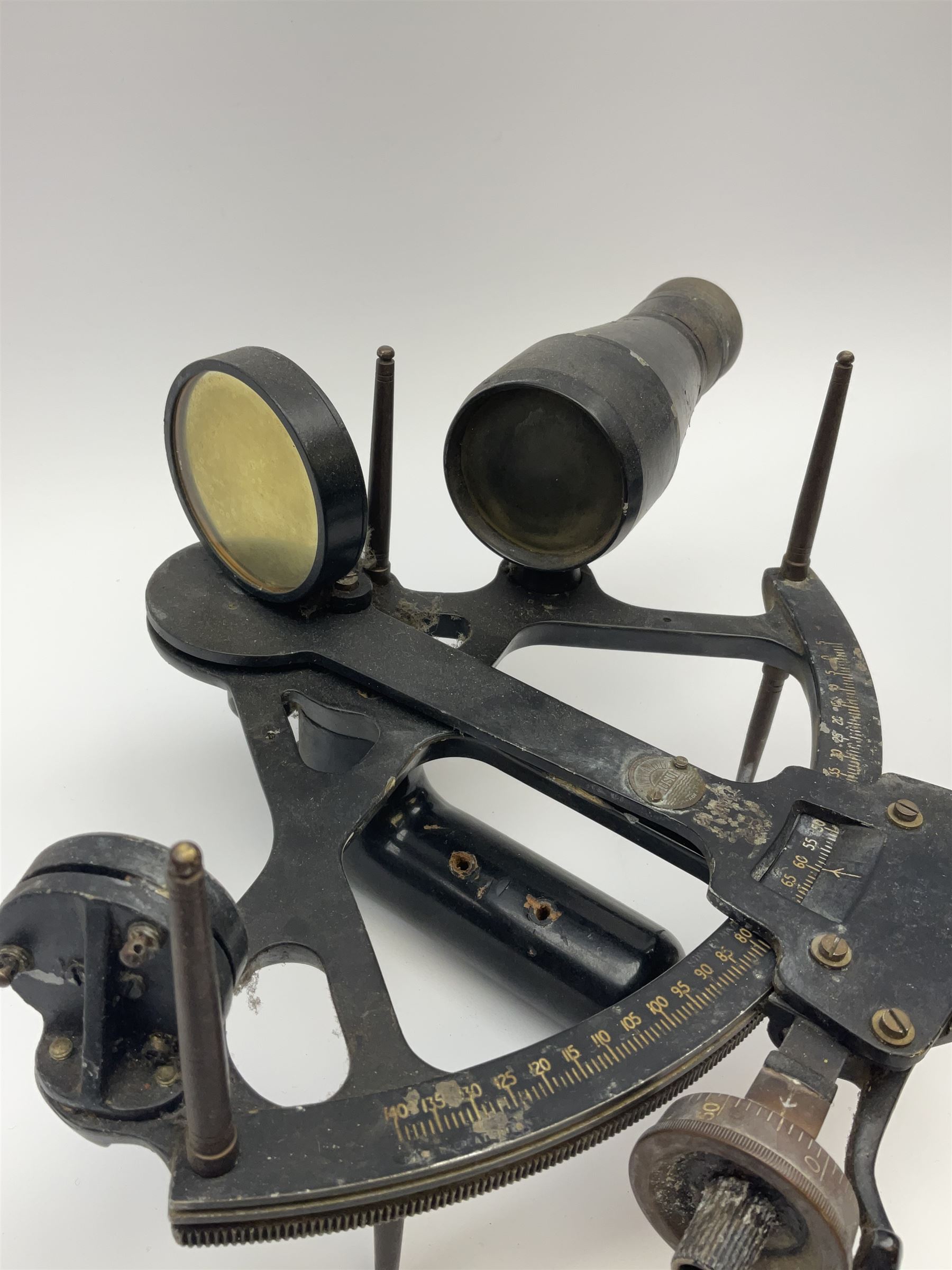 Henry Hughes & Son 'Husun' black finished brass sextant marked H (broad arrow) O No.287 W29cm; and a 19th century Harris & Son London brass three-draw telescope with leather covered tube L72cm extended (2)