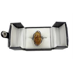 Silver Baltic amber ring with leaf design gallery, stamped 925 
