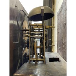 18th century c1760 oak cased George III longcase clock by William Eastwood of Burnley, with a stepped caddy top on a projecting cornice and blind frieze, square glazed door flanked by two turned pillars with gesso capitals, trunk with conforming recessed pillars and a full length wavy topped door, on a square plinth with a raised panel and shaped skirting, 12” square brass dial, 11” chapter ring with Roman numerals and five-minute Arabic's,  