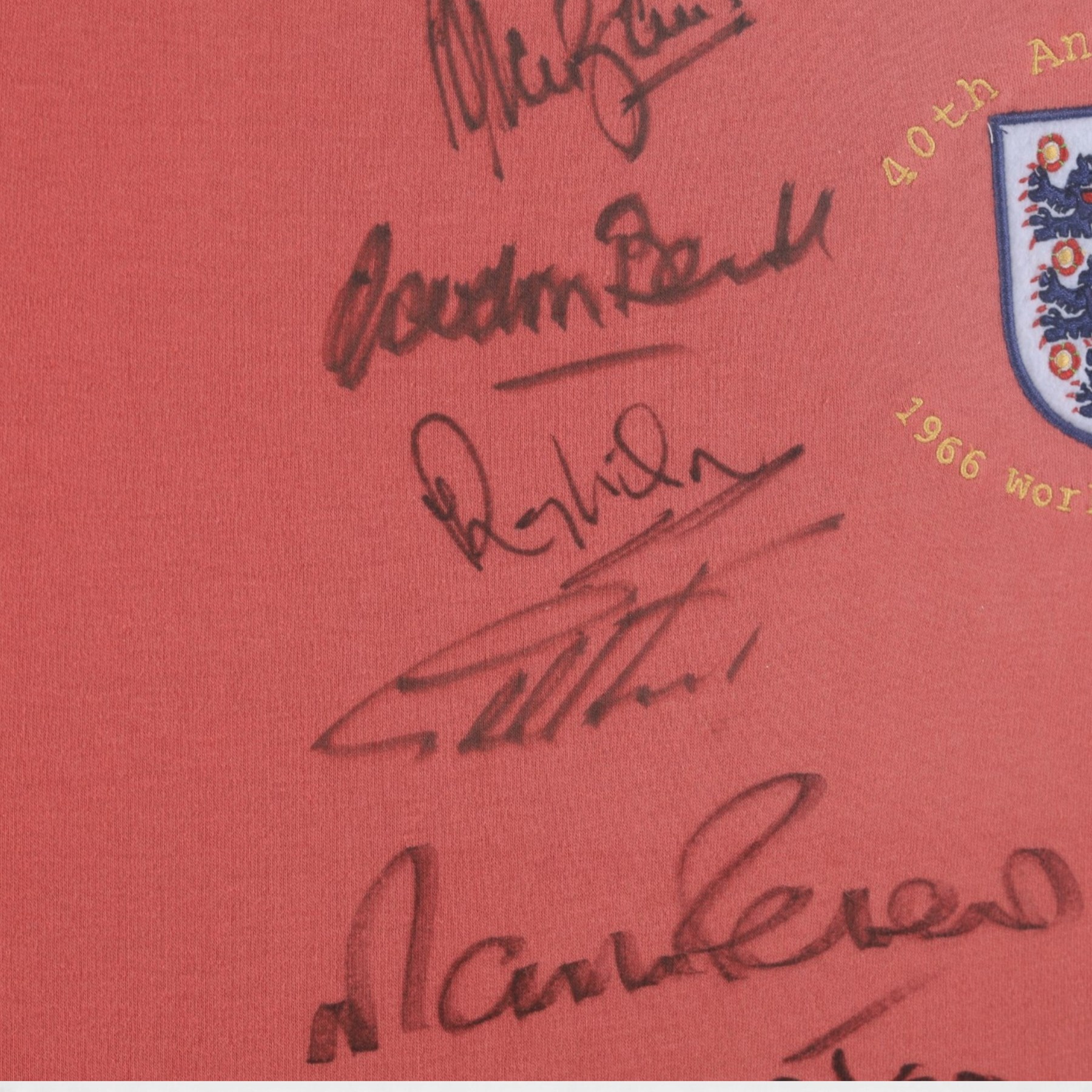 Signed 40th anniversary 1966 England World Cup shirt, signed by Gordon Banks, George Cohen, Ray Wilson, Jack Charlton, Alan Ball, Nobby Stiles, Roger Hunt, Martin Peters and Geoff Hurst, framed with certificate of authenticity from Richard Hill verso, frame H91cm