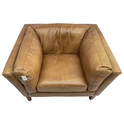 Contemporary mid-20th century shaped armchair with low back and sides upholstered in tan leather, raised on square tapering supports