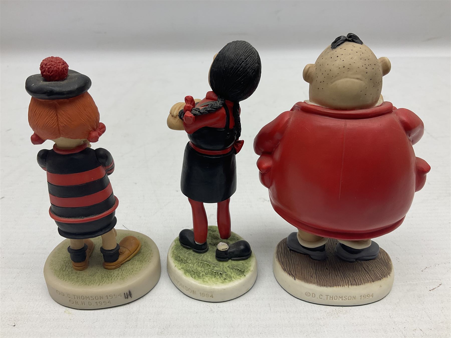 Eleven Robert Harrop figures from the Beano Dandy collection, comprising One Man & His Dawg BDS08, Picnic Desperate Dan BDS04, Fatty BD07, Desperate Dan BD03, Roger the Dodger BD20, Dennis the Menace BD01, Beryl the Peril BD05, Minnie the Minx BD04, Surfing BP03, two Spotty BD16, together with a Genuine Beano Ware lidded box (12)