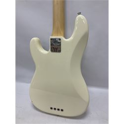 Fender Precision Bass guitar, in Olympic White finish with tortoiseshell effect scratchboard, serial no US15103092, in black Fender hard case with Fender strap and warranty card, guitar L116cm