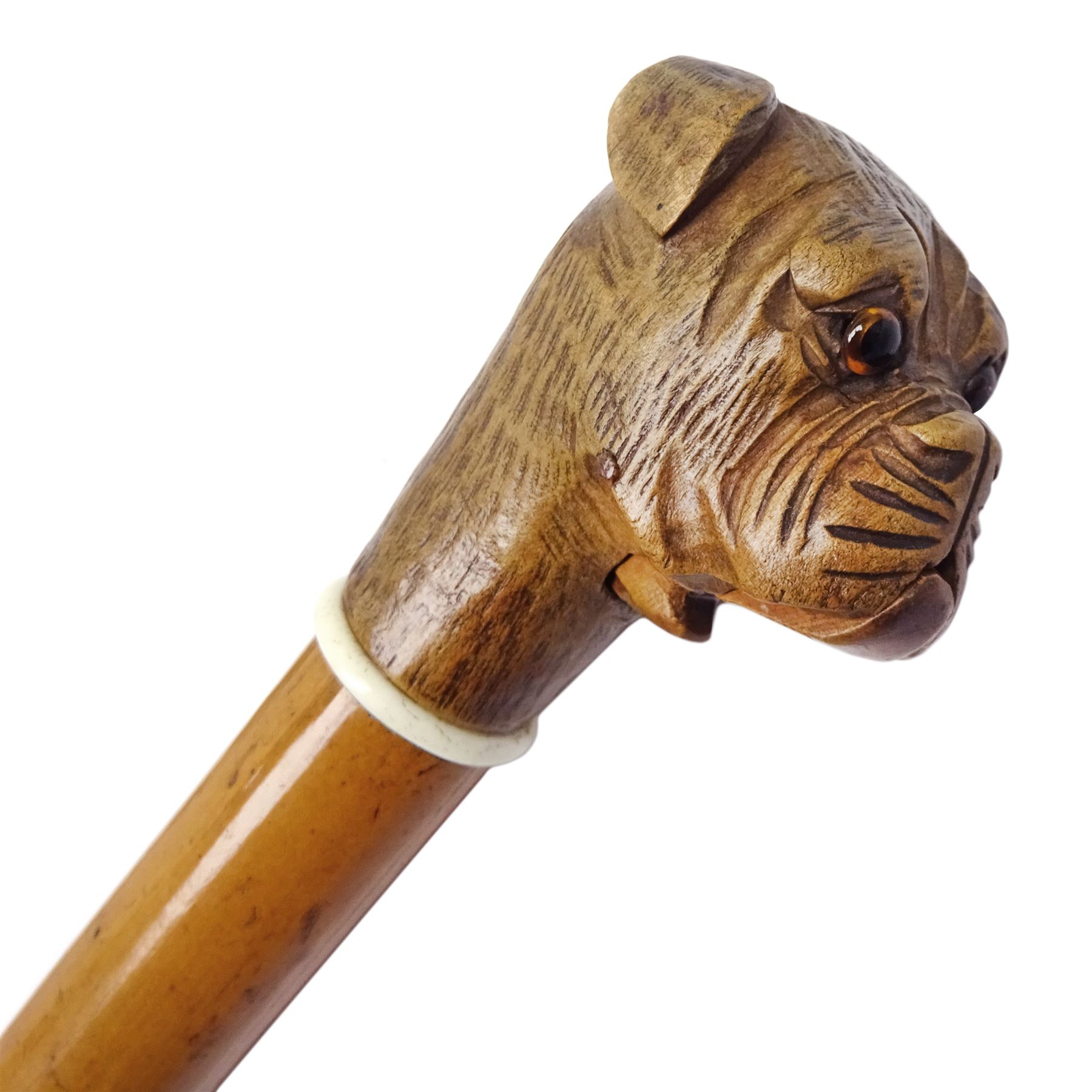 20th century walking cane, the carved wooden handle modelled as the head of a boxer dog with inset glass eyes and articulated and sprung jaw, upon a tapering Malacca shaft, L86.5cm