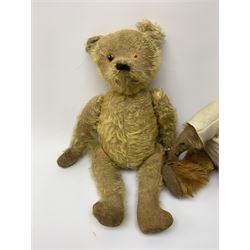 Early 20th century cinnamon coloured bear c1920, possibly continental, with unusual hedgehog styled head/face, swivel jointed head, wood wool filled body with jointed limbs, five claw stitches to feet  and inoperative growler mechanism H16