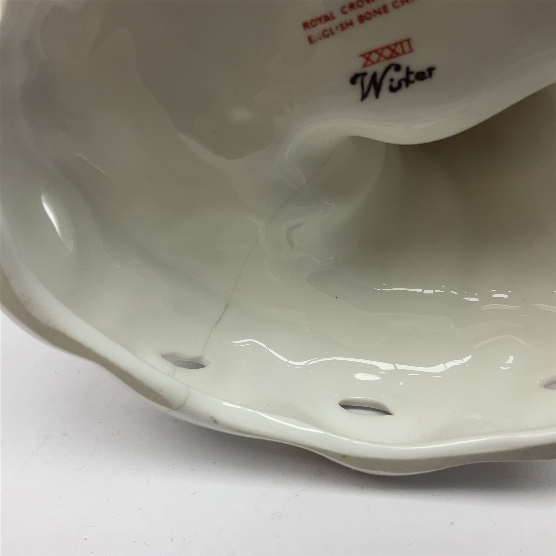 Royal Crown Derby figurine, Winter, modelled as a man with crossed arms on ice skates, by M. Townsend, with printed marks beneath, H24cm