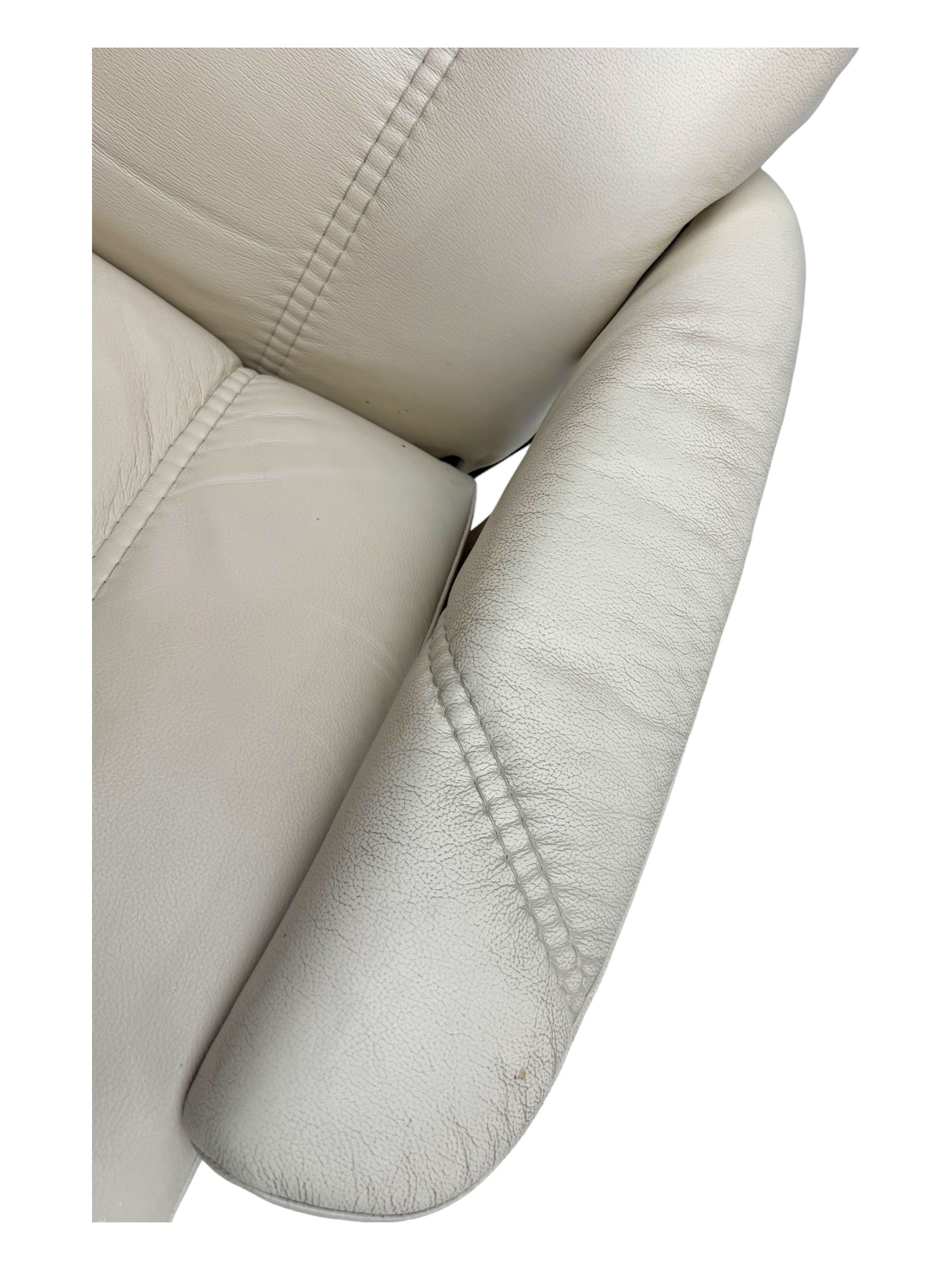 Ekornes Stressless - swivel and reclining armchair upholstered in cream leather, high back and padded armrests, raised on circular base