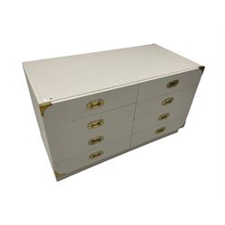 Military style painted drawer unit, fitted with eight drawers, applied brass handles and corner brackets, light grey and wax finish 
