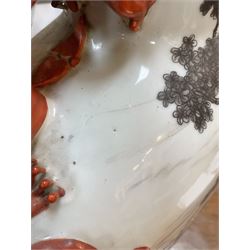 Chinese Republic period porcelain moon flask vase, of typical compressed spherical form, the neck and shoulders with applied iron red dragon handles, the body decorated in iron-red and grisaille with a 'one hundred children' design, depicting various children at play and engaged in musical pursuits within a garden setting, with apocryphal Qianlong mark beneath, H47cm