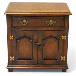 Titchmarsh & Goodwin - small oak side cupboard, moulded rectangular top over single drawer...