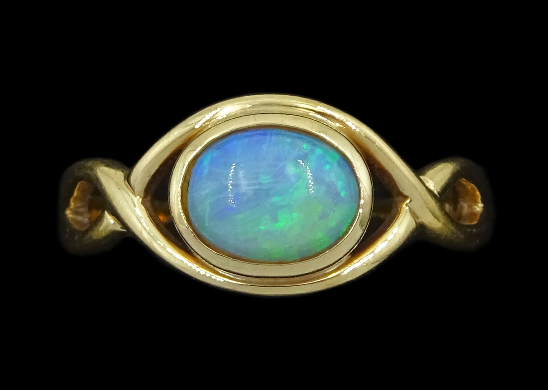 9ct gold single stone opal ring, with crossover design shoulders, Sheffield 2005