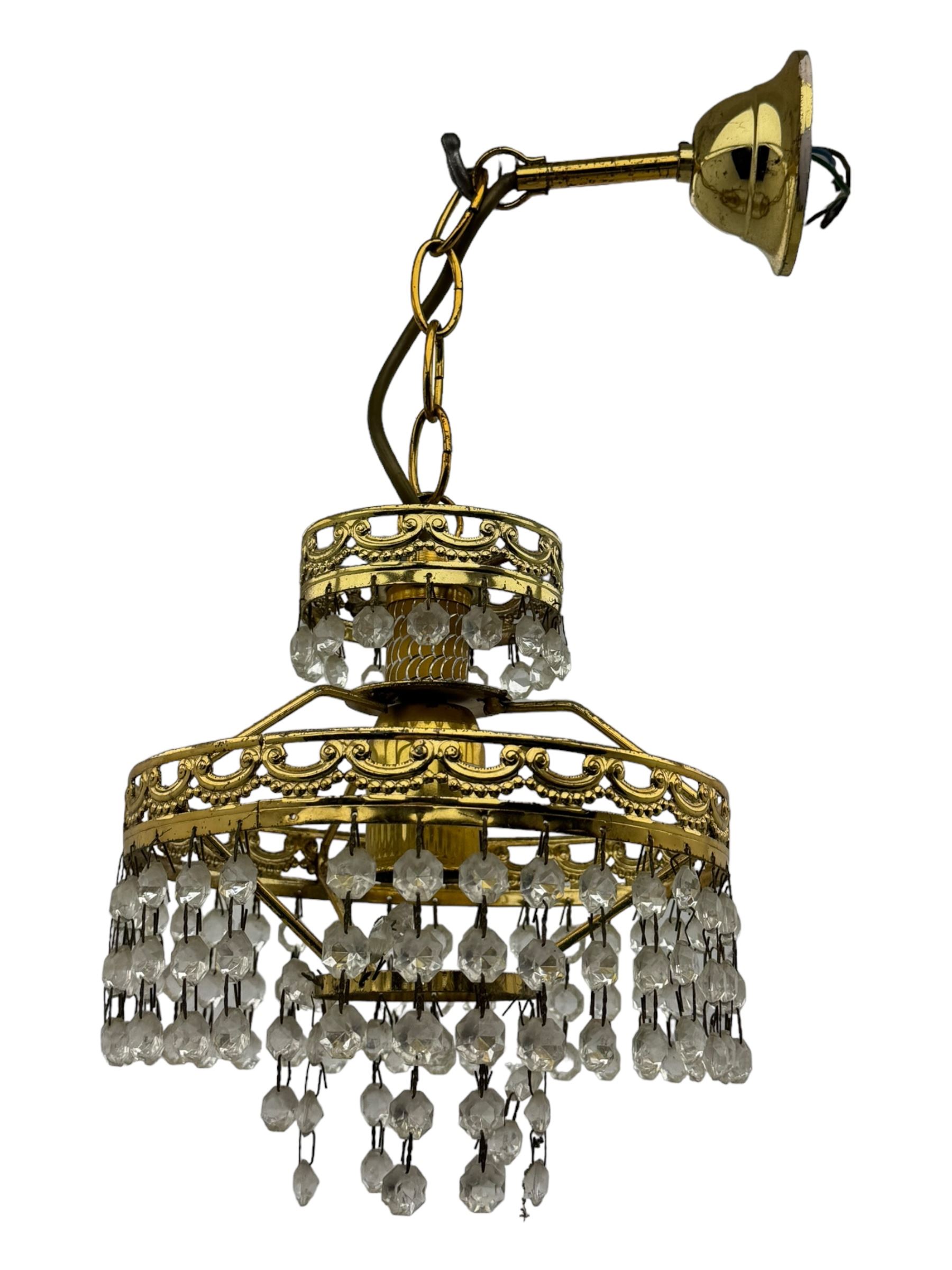 Collection of vintage and modern light fixtures, including copper pendant light, brass five-arm chandelier, hanging lantern and two small chandeliers with hanging faceted droplets (6)