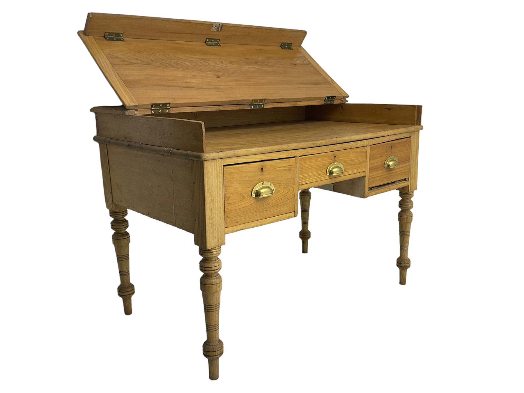 Early 20th century light oak kneehole desk, rectangular hinged top, fitted with frieze drawer flanked by two deep drawers, raised on ring turned supports