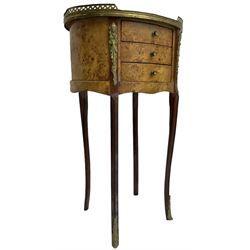 Late 20th century French design figured elm and bedside table, raised pierced gilt metal gallery over oval top, fitted with three mahogany lined drawers flanked by gilt metal mounts of female mask and foliate form, on cabriole supports