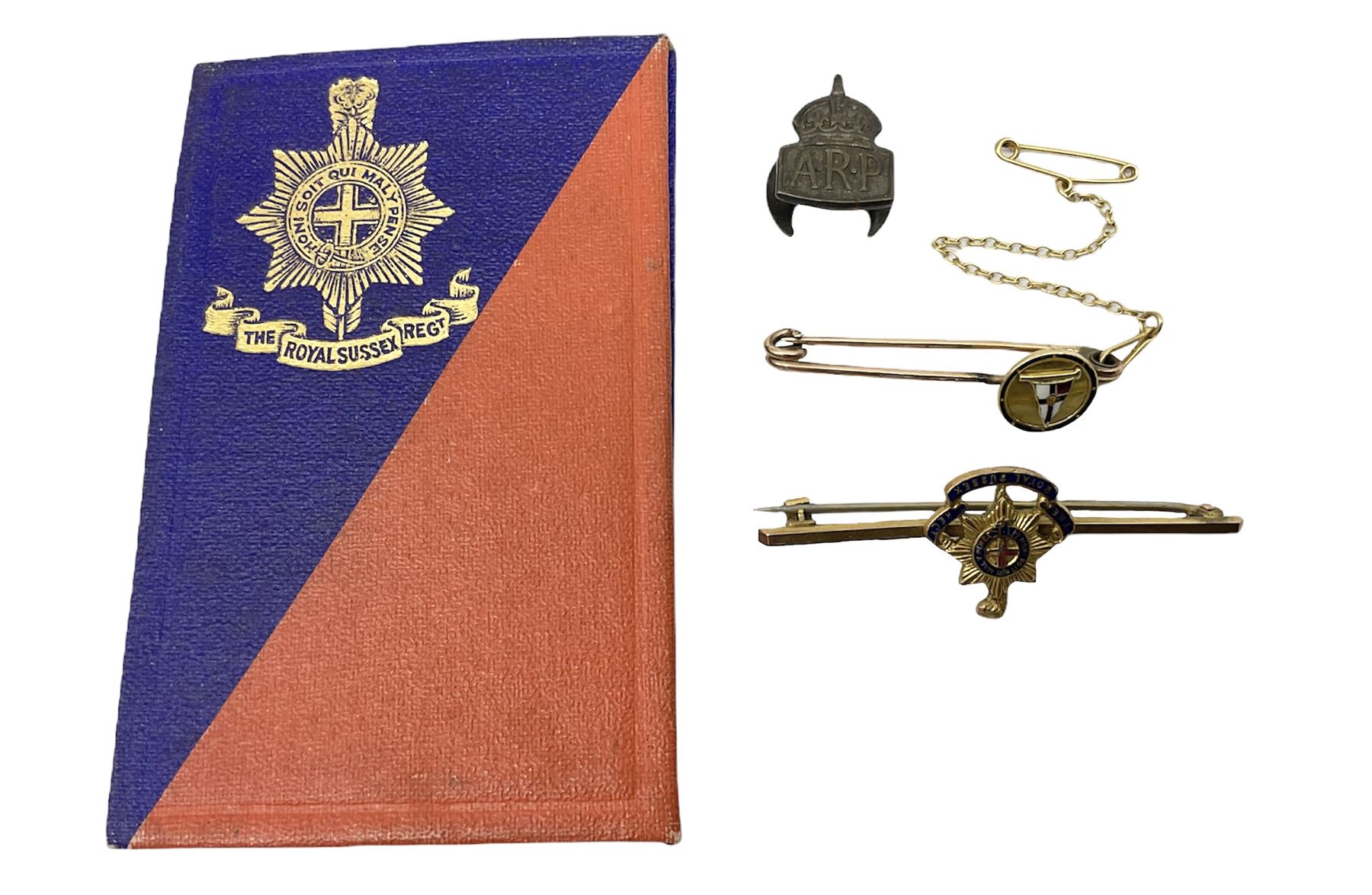 Royal Sussex Regiment 9ct gold sweetheart brooch with Regimental Association membership card to 6406670 Pte. Brock dated 1940; an 18ct gold pin badge enamelled with a shipping company (?) pennant; and an ARP button-hole badge (4)