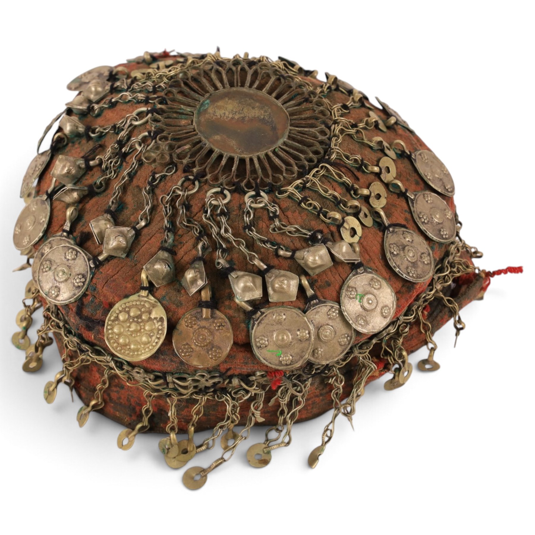 Collection of Middle Eastern jewellery, including silver necklace with a crescent  shaped pendent with beadwork and barrel tasselled ends, nickel silver wedding necklace with filigree decoration, coin bracelet, two bridal wedding caps and two others 