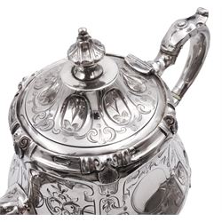 Victorian four piece silver tea service, comprising teapot, coffee pot, cream jug and twin handled open sucrier, each of hexagonal bellied form, the cream jug and sucrier with gilded interiors, engraved with foliate detail and monogrammed initials to central circular panel, with scroll handles and upon four scroll pad feet, the teapot and coffee handles with ivory insulators, the coffee pot, cream jug and sucrier hallmarked Henry Holland, London 1866, the teapot hallmarked Henry Holland, London 1856, approximate total weight 86.24 ozt (2682.6 grams) This item has been registered for sale under Section 10 of the APHA Ivory Act