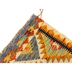 Chobi Kilim ivory ground rug, decorated with multi-colour geometric lozenges, the repeating amber border separated by an indigo band