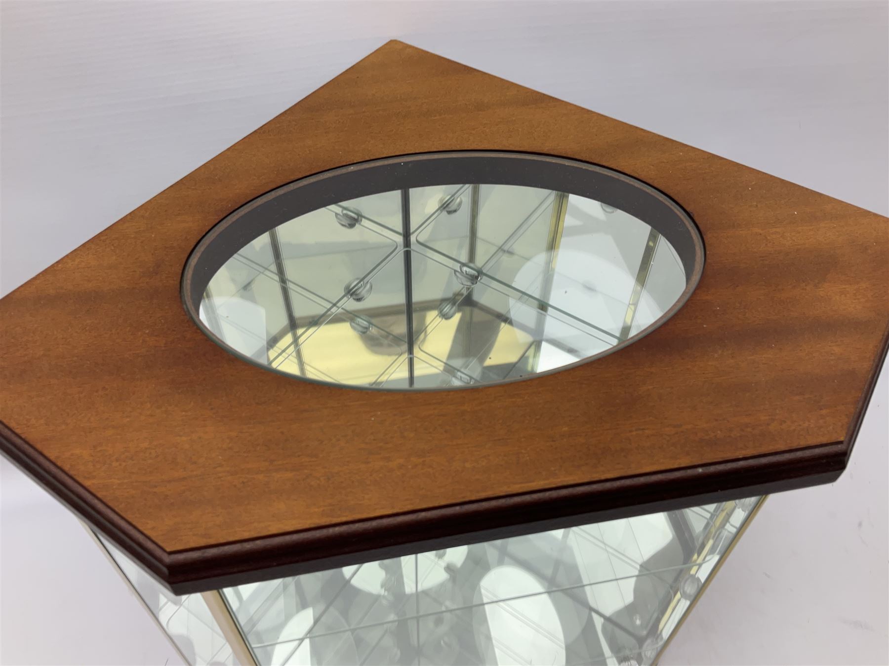 Swarovski Crystal Masquerade trilogy; 1999 Masquerade Pierrot, 2000 Columbine, 2001 Harlequin all with accompanying plaque, stand and original box, together with a glass display case with mirrored back and sides 