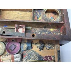 Late 19th century mahogany artists travel box, the hinged cover opening to reveal a compartmented interior containing a number of watercolour blocks and ceramic mixing dishes, the cover interior with paper label detailed 'Superior London Made Water Colors Warranted Soft & Brilliant', H6.5cm W19.5cm D13cm