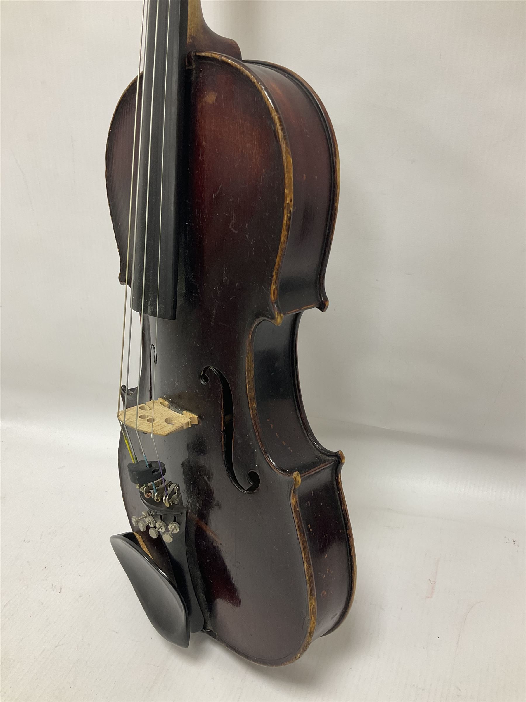 Neuner & Hornstiner early 20th century half size violin c1900, two piece maple back and ribs with a spruce top in a later ridged carrying case, no bow Length 57cm