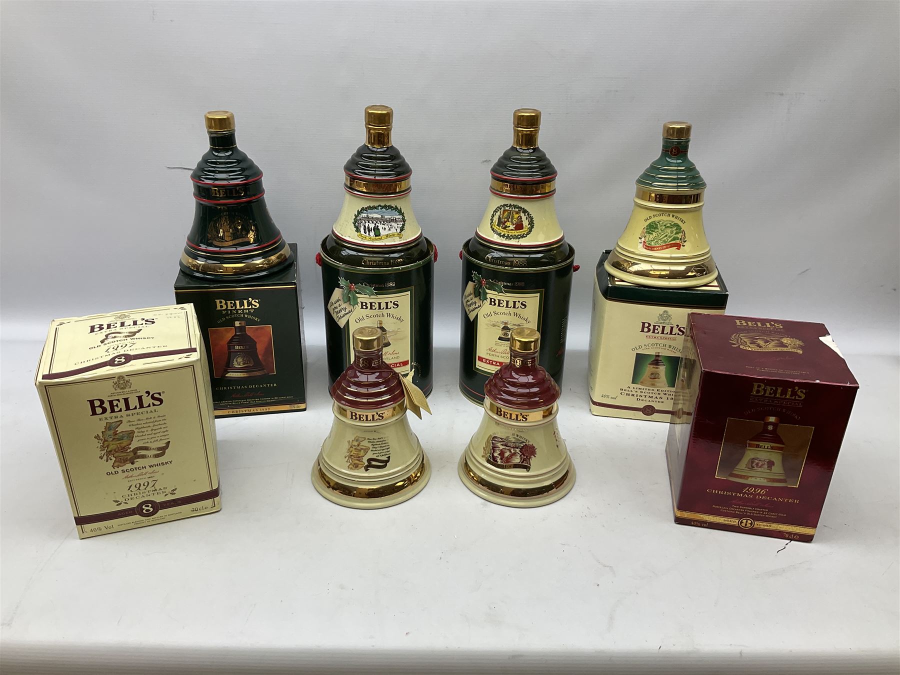 Six Bell's Old Scotch Whisky Christmas ceramic decanters comprising 1988, 1989, 1992, 1996, 1997 and 1998 all in original boxes and decanter seals intact 